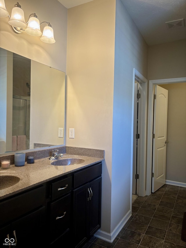 5932 Edelle Dr, Indianapolis, IN 46237 - bathroom featuring double vanity and an enclosed shower
