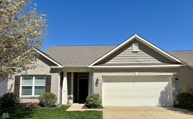 5932 Edelle Dr, Indianapolis, IN 46237 - view of front facade featuring brick siding, an attached garage, concrete driveway, and roof with shingles