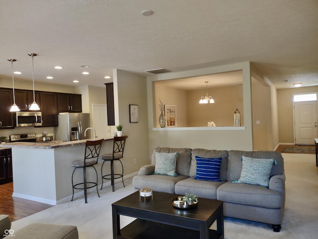 5932 Edelle Dr, Indianapolis, IN 46237 - living area with a chandelier, recessed lighting, and light colored carpet