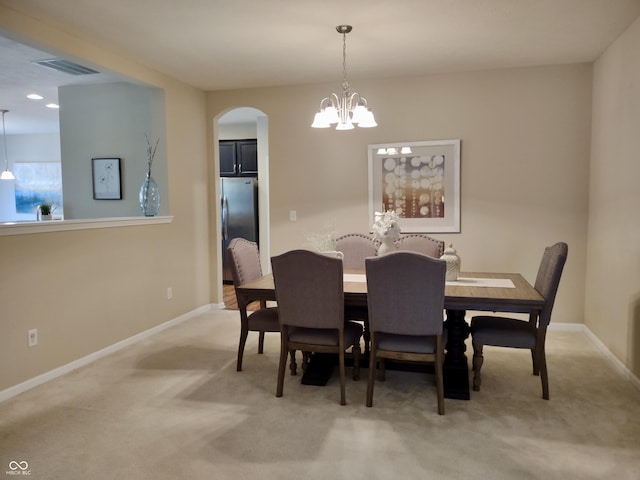 5932 Edelle Dr, Indianapolis, IN 46237 - dining room with arched walkways, light colored carpet, a chandelier, and recessed lighting