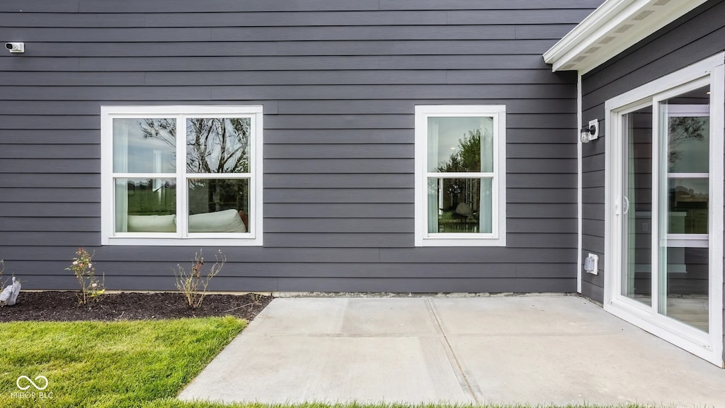 5002 Jasper Ridge Blvd, Indianapolis, IN 46235 - view of property exterior with a patio area