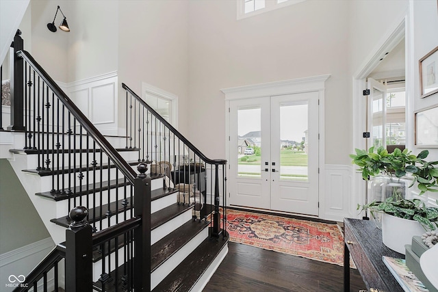 5706 Bentbrook Dr, Bargersville, IN 46106 - foyer with stairway, a decorative wall, plenty of natural light, wainscoting, and wood finished floors