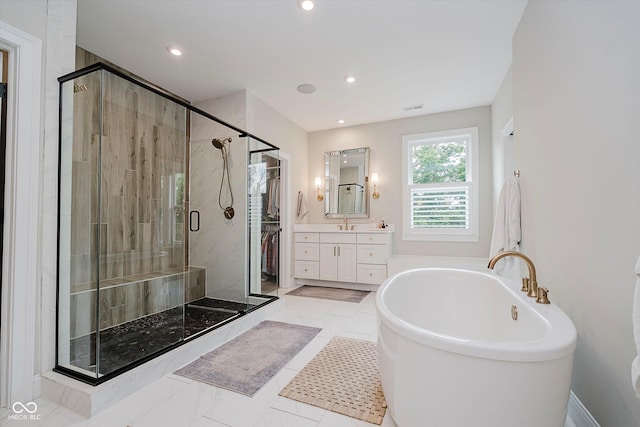 5706 Bentbrook Dr, Bargersville, IN 46106 - full bath featuring a freestanding tub, vanity, a shower stall, and recessed lighting