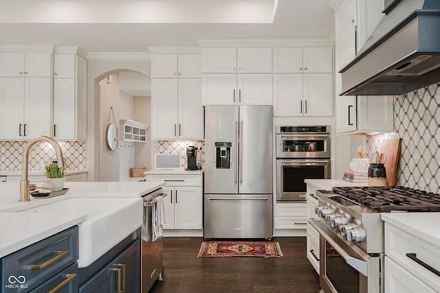 5706 Bentbrook Dr, Bargersville, IN 46106 - kitchen featuring premium appliances, under cabinet range hood, white cabinetry, and light countertops