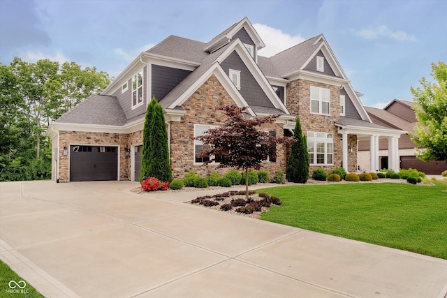 5706 Bentbrook Dr, Bargersville, IN 46106 - craftsman-style home with stone siding, a front yard, driveway, and roof with shingles