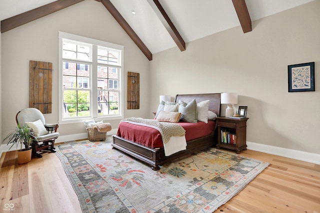 12839 Bird Cage, Carmel, IN 46032 - bedroom featuring wood finished floors, beam ceiling, and high vaulted ceiling