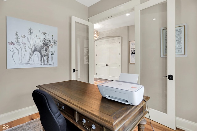 12839 Bird Cage, Carmel, IN 46032 - home office with a chandelier and wood finished floors