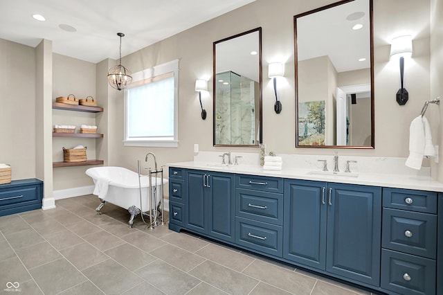 12839 Bird Cage, Carmel, IN 46032 - full bathroom with double vanity, a freestanding tub, a chandelier, and tile patterned flooring