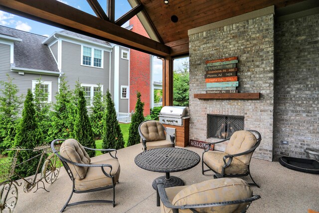 12839 Bird Cage, Carmel, IN 46032 - view of patio featuring a grill, an outdoor brick fireplace, and a gazebo
