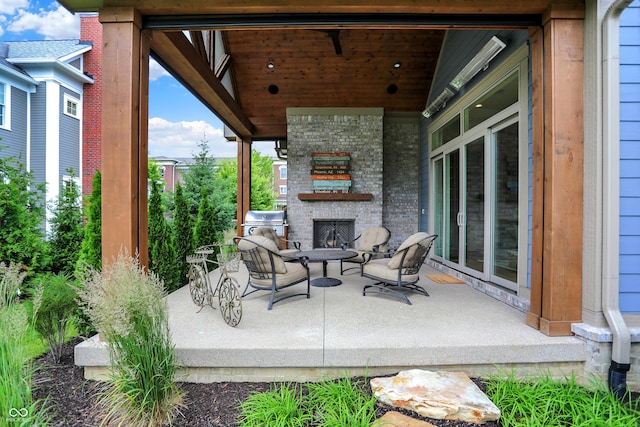 12839 Bird Cage, Carmel, IN 46032 - view of patio / terrace with an outdoor stone fireplace