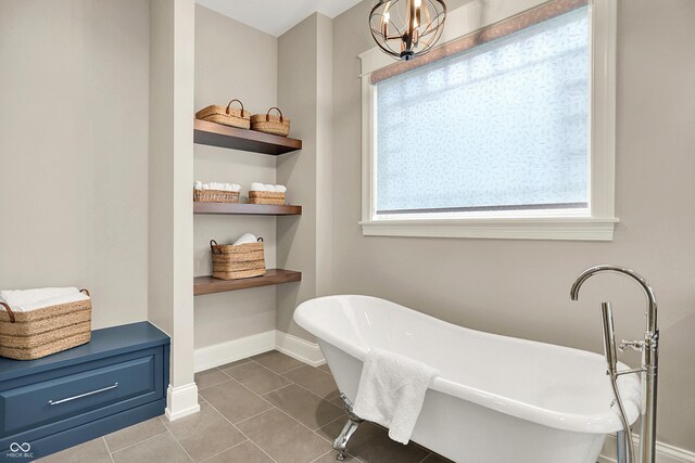 12839 Bird Cage, Carmel, IN 46032 - full bathroom featuring tile patterned flooring, a freestanding bath, and plenty of natural light