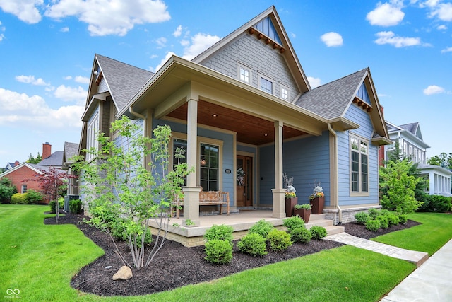 12839 Bird Cage, Carmel, IN 46032 - view of front of property featuring a porch, a front lawn, and roof with shingles