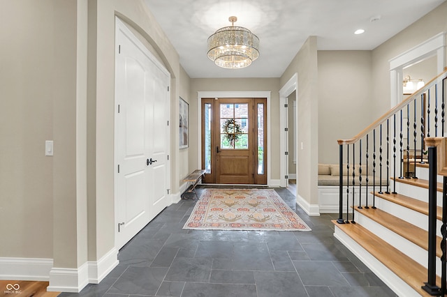 12839 Bird Cage, Carmel, IN 46032 - entryway featuring a chandelier and stairway