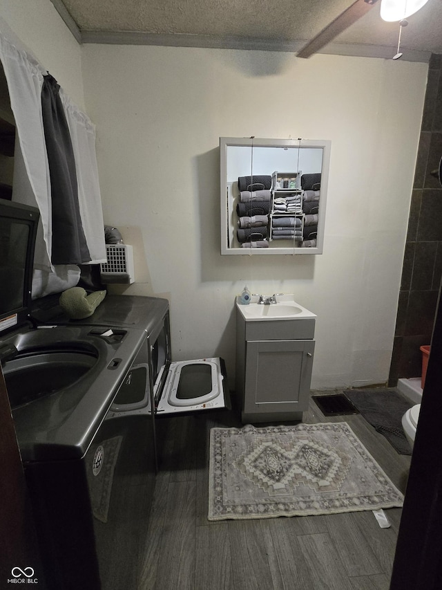 209 N Middle St, Spencer, IN 47460 - full bathroom featuring independent washer and dryer, vanity, wood finished floors, a ceiling fan, and a tile shower