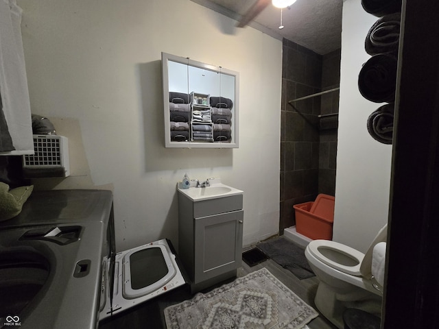 209 N Middle St, Spencer, IN 47460 - full bathroom featuring a tile shower, washing machine and dryer, and vanity