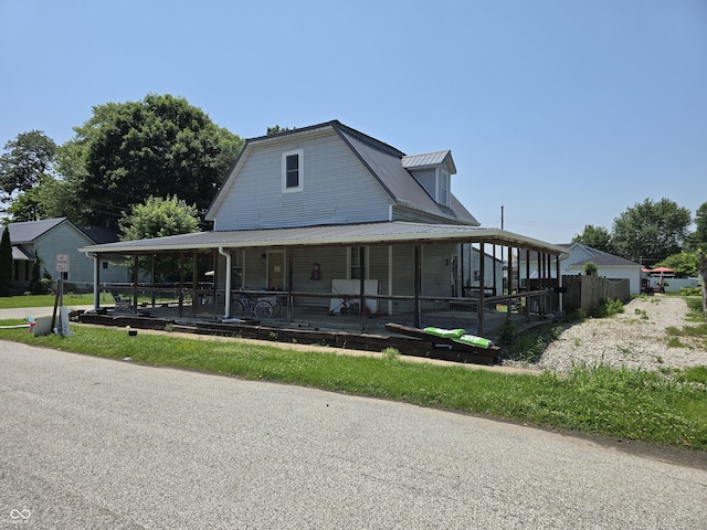 209 N Middle St, Spencer, IN 47460 - farmhouse-style home featuring a metal roof and covered porch