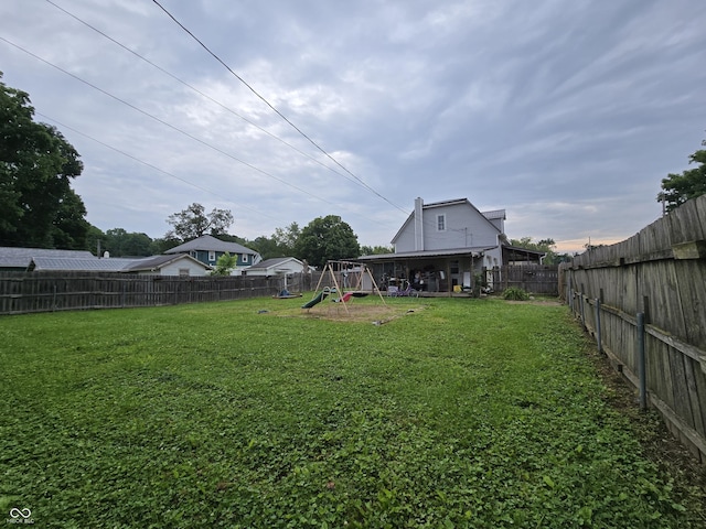 209 N Middle St, Spencer, IN 47460 - fenced backyard with a playground