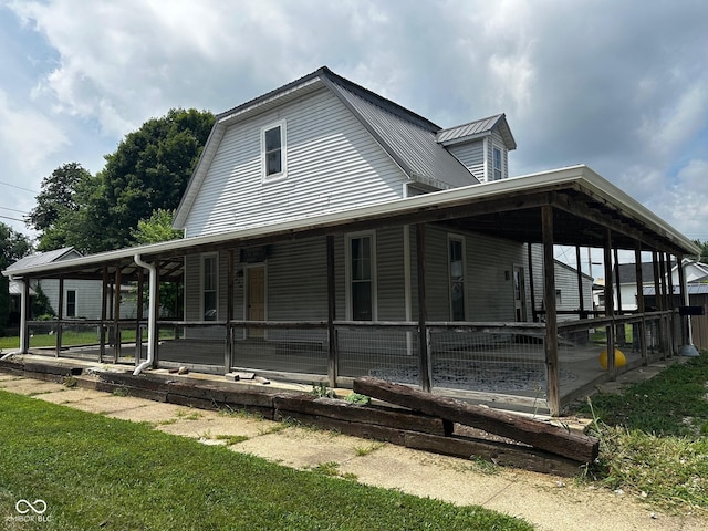 209 N Middle St, Spencer, IN 47460 - view of property exterior with a metal roof