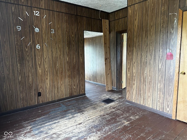 209 N Middle St, Spencer, IN 47460 - empty room with dark wood finished floors and wooden walls