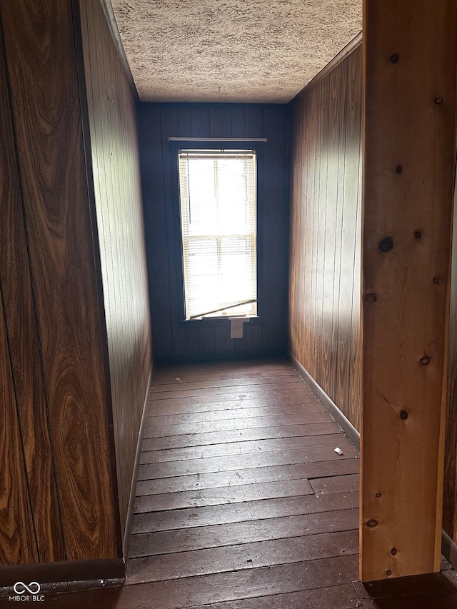 209 N Middle St, Spencer, IN 47460 - unfurnished room featuring a textured ceiling, wooden walls, and hardwood / wood-style floors