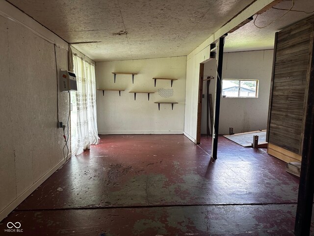 209 N Middle St, Spencer, IN 47460 - spare room featuring concrete floors and an AC wall unit