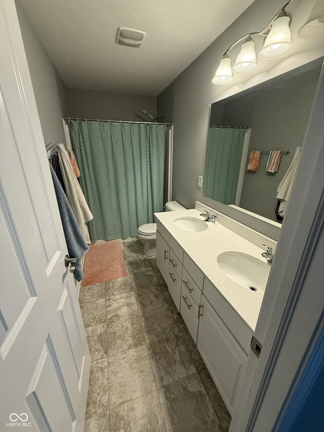 15961 Foothill Dr, Noblesville, IN 46060 - full bathroom featuring double vanity, a shower with shower curtain, and a textured ceiling