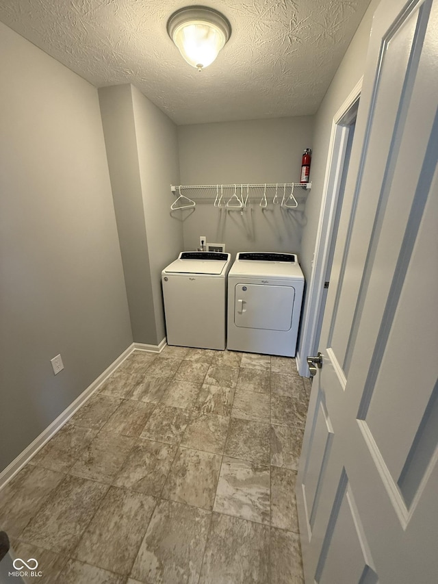 15961 Foothill Dr, Noblesville, IN 46060 - laundry area with washing machine and dryer and a textured ceiling