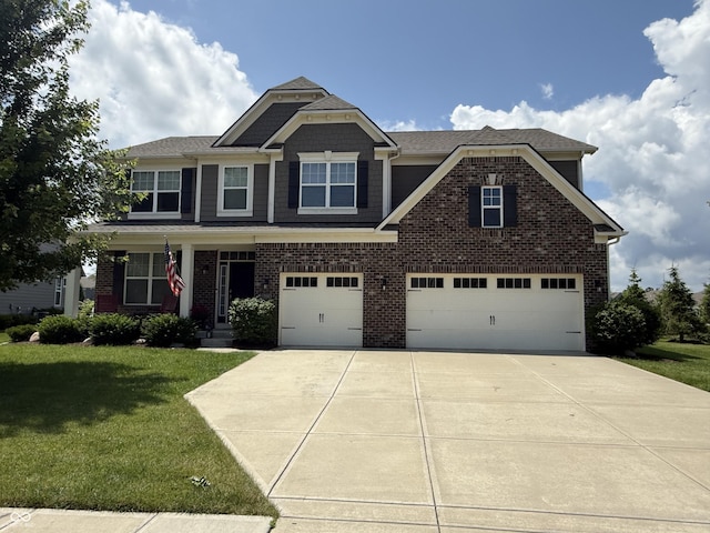 15961 Foothill Dr, Noblesville, IN 46060 - craftsman-style house with brick siding, driveway, a garage, and a front yard
