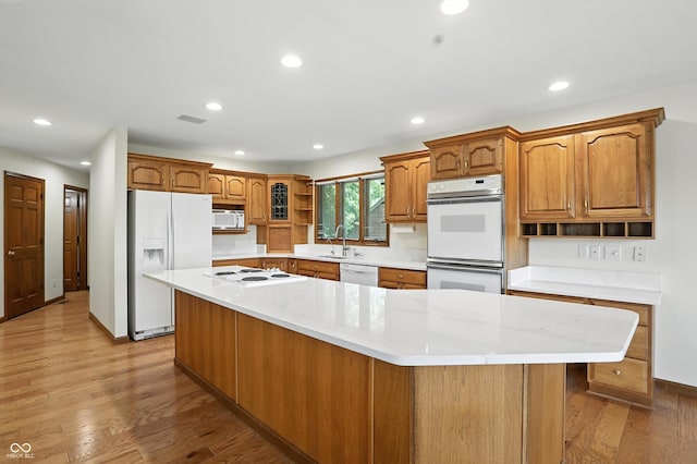 1326 Pebble Brook Dr, Noblesville, IN 46062 - kitchen featuring white appliances, open shelves, recessed lighting, a spacious island, and light countertops
