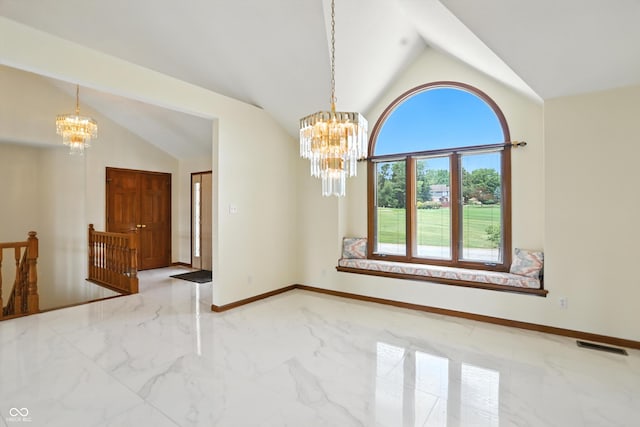 1326 Pebble Brook Dr, Noblesville, IN 46062 - empty room featuring a chandelier, marble tiled flooring, and lofted ceiling