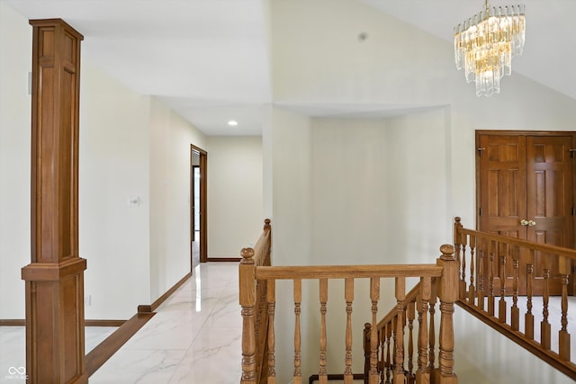 1326 Pebble Brook Dr, Noblesville, IN 46062 - corridor with an upstairs landing, light marble finish flooring, a chandelier, and recessed lighting