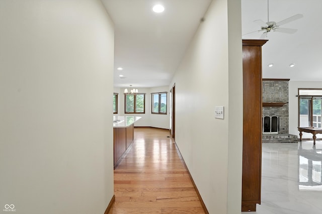 1326 Pebble Brook Dr, Noblesville, IN 46062 - hallway with recessed lighting, a chandelier, and light wood finished floors