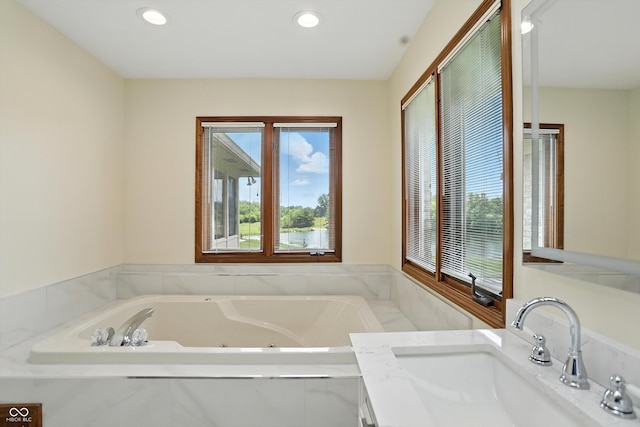 1326 Pebble Brook Dr, Noblesville, IN 46062 - bathroom with a jetted tub, recessed lighting, and vanity