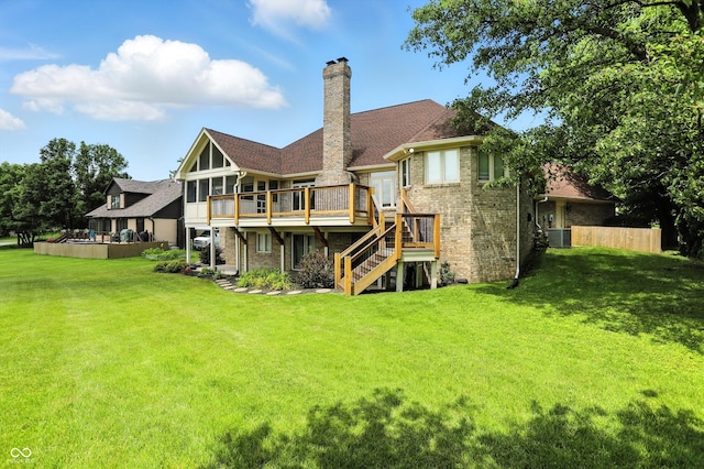 1326 Pebble Brook Dr, Noblesville, IN 46062 - rear view of property with stairway, a deck, a chimney, brick siding, and a sunroom