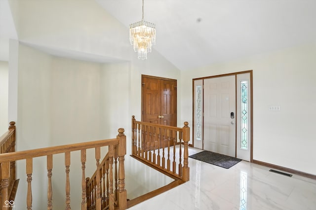 1326 Pebble Brook Dr, Noblesville, IN 46062 - foyer entrance with lofted ceiling, a chandelier, and marble tiled floors