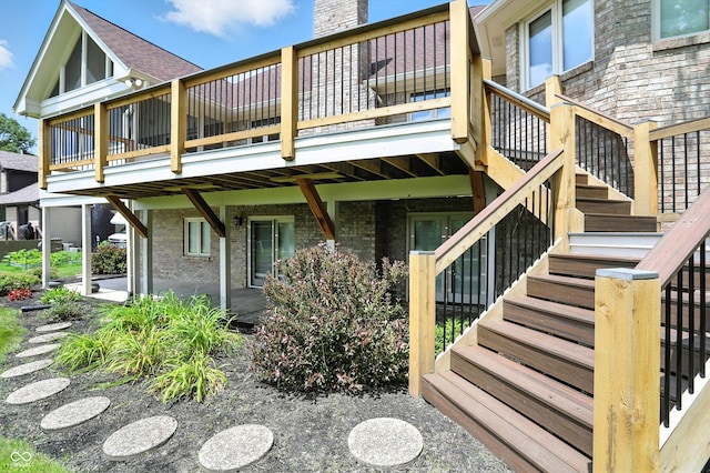 1326 Pebble Brook Dr, Noblesville, IN 46062 - rear view of house featuring brick siding, stairway, a wooden deck, and a patio area