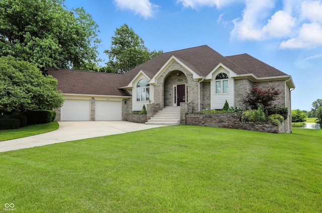 1326 Pebble Brook Dr, Noblesville, IN 46062 - view of front of property with an attached garage, driveway, a front yard, a shingled roof, and brick siding