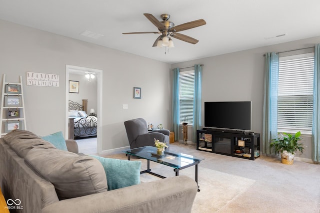 2421 Creek Bank Dr, Columbus, IN 47201 - living room with ceiling fan and light carpet