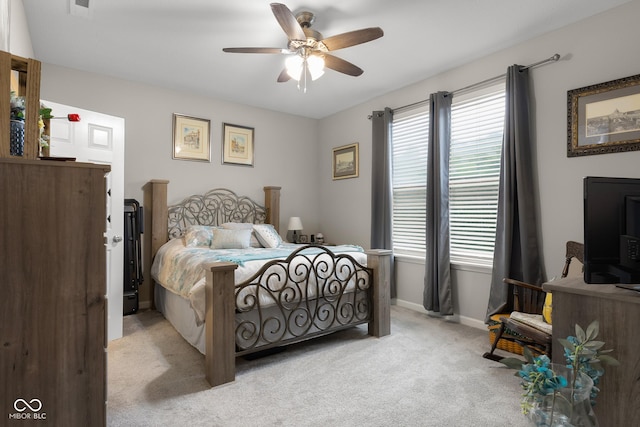 2421 Creek Bank Dr, Columbus, IN 47201 - bedroom featuring multiple windows, light colored carpet, and ceiling fan