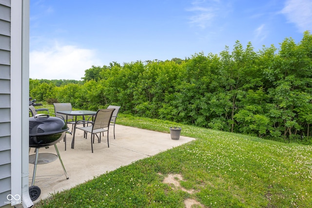 2421 Creek Bank Dr, Columbus, IN 47201 - view of green lawn with a patio area and outdoor dining space