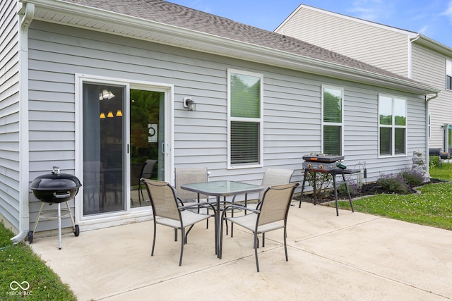 2421 Creek Bank Dr, Columbus, IN 47201 - view of patio featuring a grill and outdoor dining space