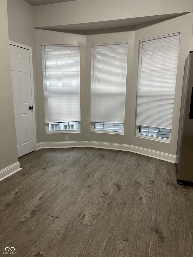 319 HST W 10th St, Anderson, IN 46016 - spare room with dark wood-type flooring