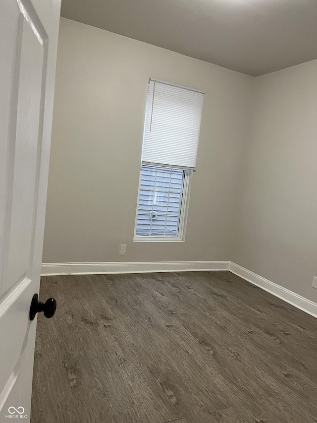 319 HST W 10th St, Anderson, IN 46016 - empty room featuring dark wood-type flooring