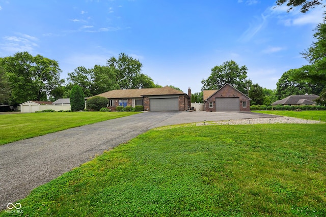 3707 E Wilson Dr, Mooresville, IN 46158 - ranch-style home with a front lawn, brick siding, and a detached garage
