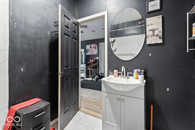 2610 Caroline Ave, Indianapolis, IN 46218 - bathroom featuring vanity and marble finish flooring