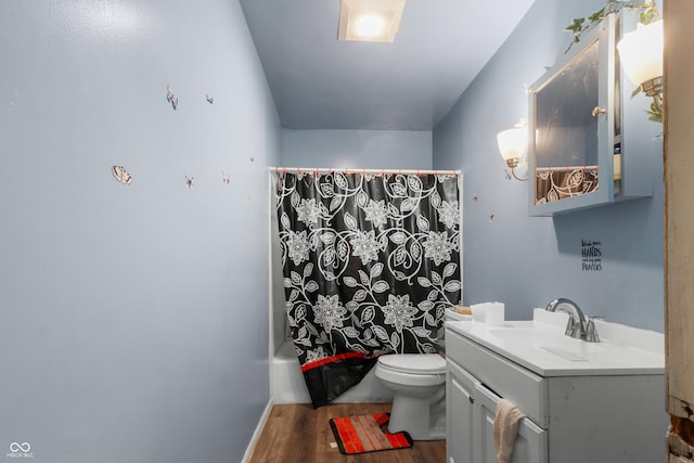2610 Caroline Ave, Indianapolis, IN 46218 - bathroom featuring wood finished floors, vanity, and shower / tub combo with curtain
