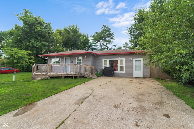 2610 Caroline Ave, Indianapolis, IN 46218 - ranch-style house with a deck and a front yard