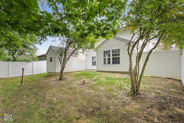 2289 Salem Park Dr, Indianapolis, IN 46239 - back of property with a fenced backyard and an outdoor structure