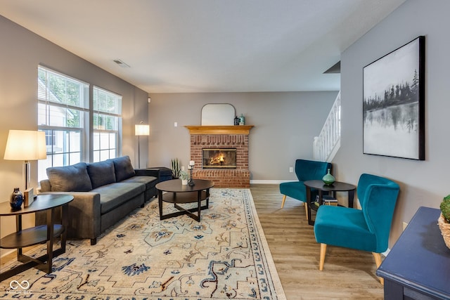 2289 Salem Park Dr, Indianapolis, IN 46239 - living room with wood finished floors, a fireplace, and stairway