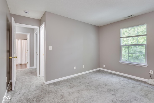 2289 Salem Park Dr, Indianapolis, IN 46239 - spare room featuring a smoke detector and carpet flooring